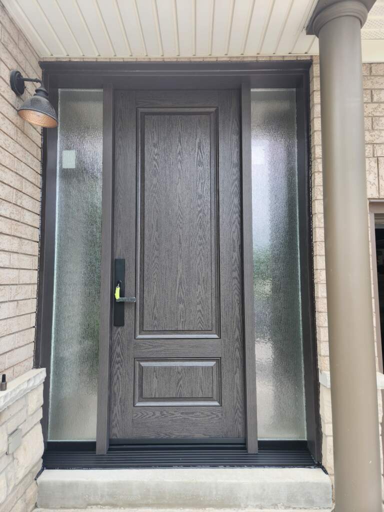 Modern black front entry door replacement in Calgary