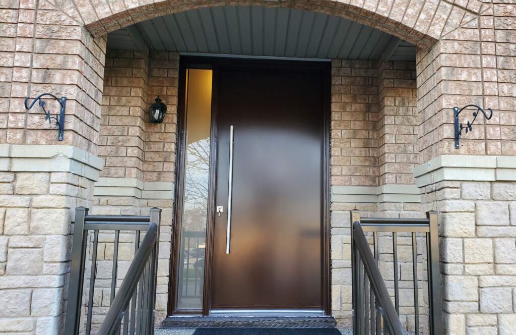 Modern steel entry door installed on a Calgary home