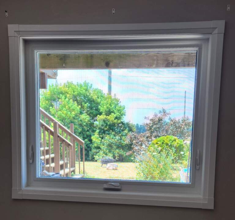 White vinyl awning window installed for ventilation in a High River home