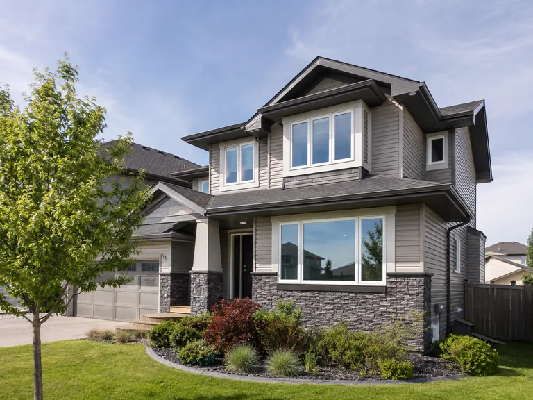 Energy-efficient vinyl replacement windows on a Chestermere home