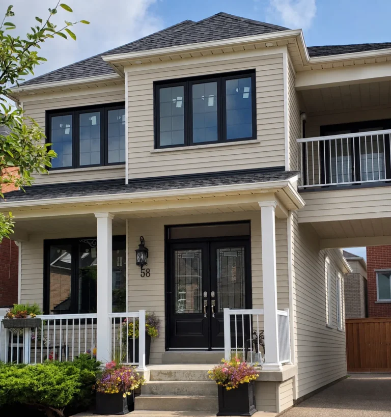 High River home with white vinyl replacement windows and horizontal siding
