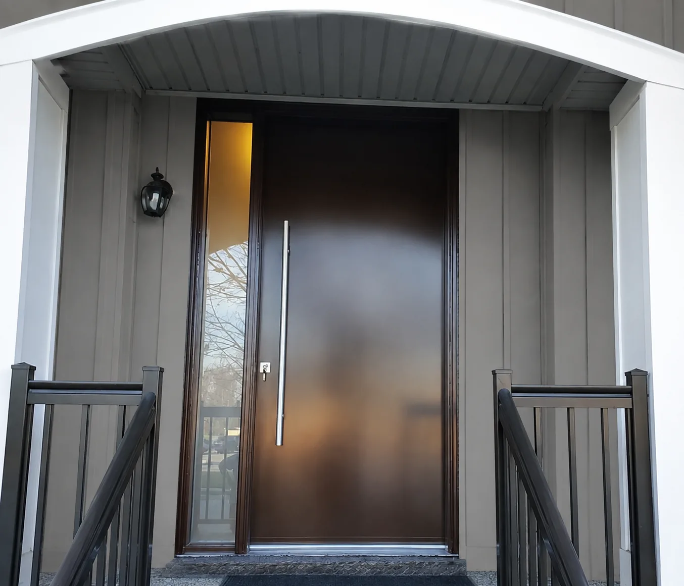 Modern insulated entry door and sidelight with board-and-batten siding